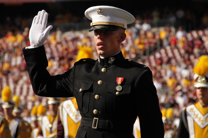 2nd Lt. Tyler Kistner, 23, from Champlin, Minn., reaffirms his oath of office during the Minnesota Gophers halftime show at TCF Bank Stadium Sept. 10. Kistner was one of three lieutenants from Marine Corps Officer Selection Station Twins Cities who participated in the ceremony. For additional imagery from the event, visit www.facebook.com/rstwincities.