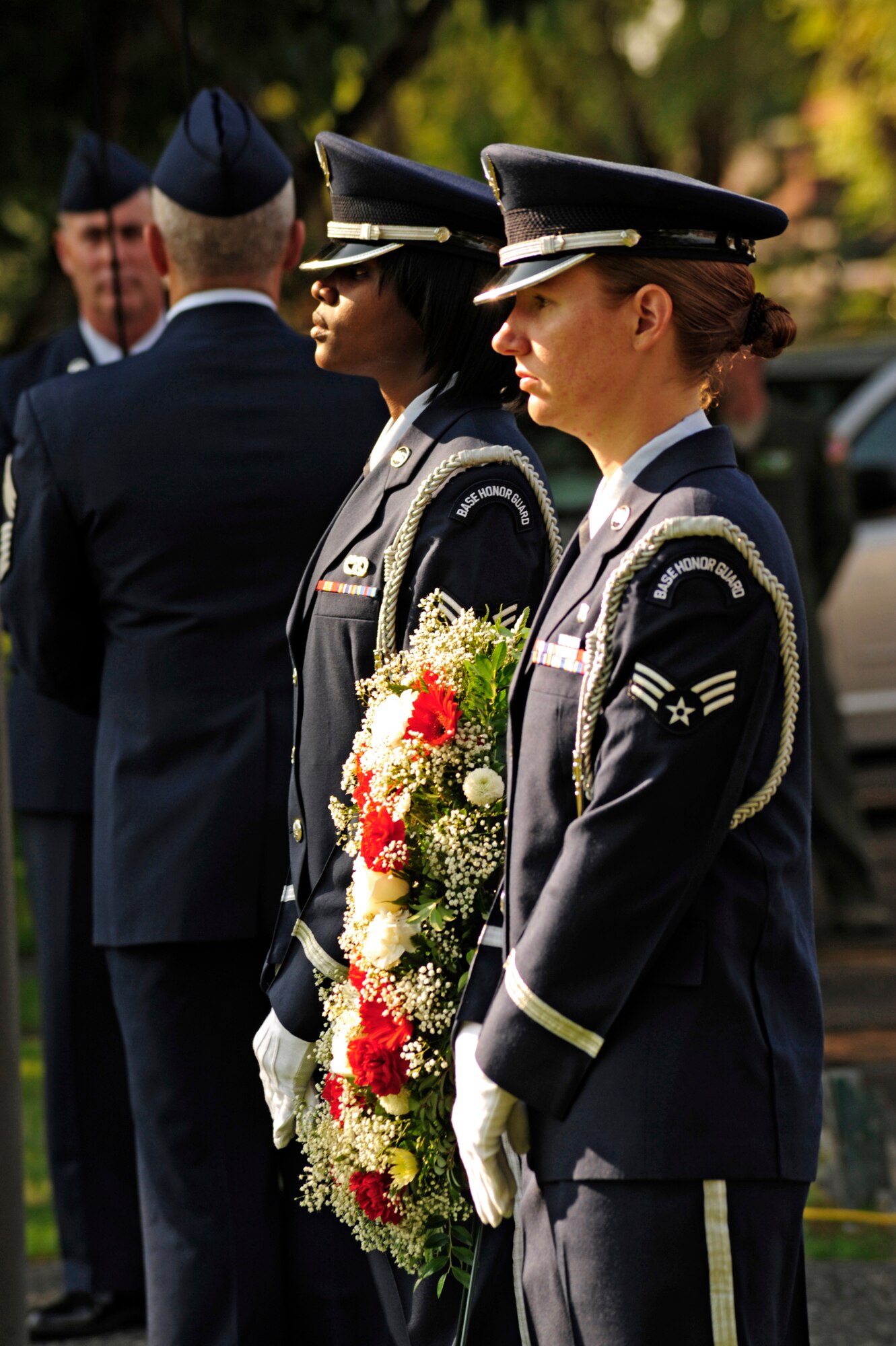 Two Honor Guard Airmen participate Sept. 9  during the final McChord Field Retreat ceremony of 2011 at Joint Base Lewis-McChord, Wash. (U.S. Air Force photo/Adamarie Lewis-Page)