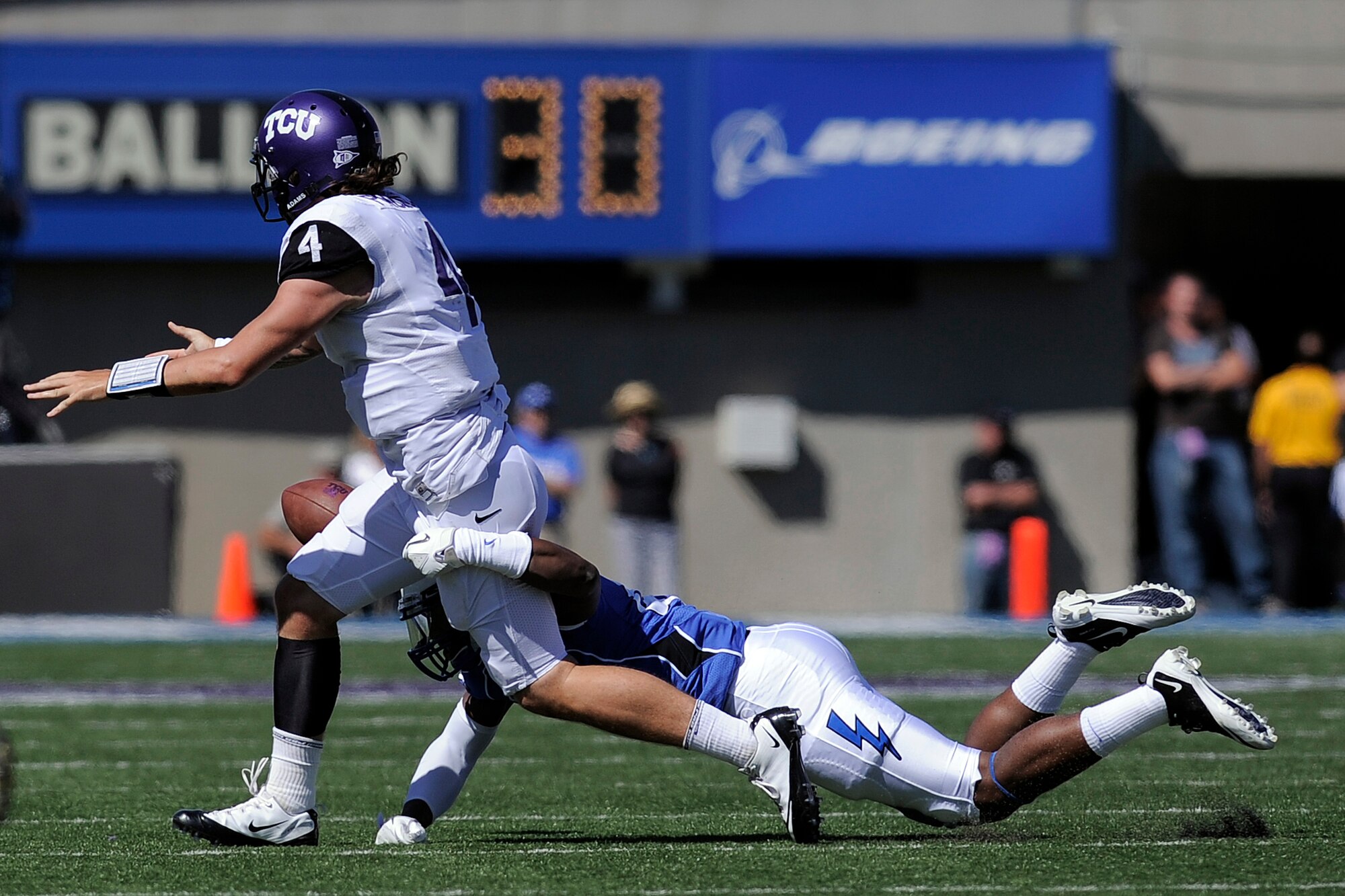 Falcon linebacker Jamil Cooks forces a fumble during a losing effort to the TCU Horned Frogs Sept. 10, 2011 at Falcon Stadium. The Frogs gained more than 400 total yards in what was almost a replay of last year's game in Fort Worth, Texas, and defeated the Falcons, 35-19. (U.S. Air Force photo/Mike Kaplan)