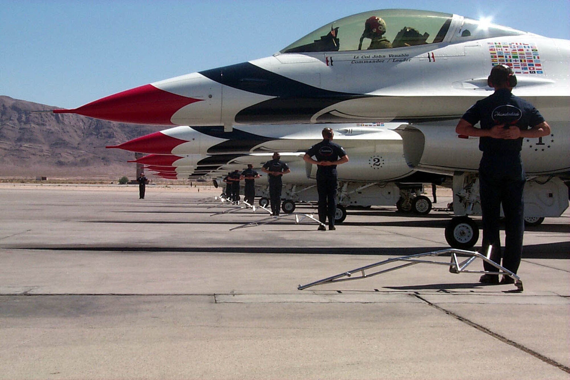 The U.S. Air Force Air Demonstration Squadron "Thunderbirds" resume flying at Nellis Air Force Base, Nev., Sept. 13, 2001 following the 9/11 terrorist attacks in New York and Washington D.C.  Lt. Gen. Dan Darnell, 57th Wing commander at the time, said "Its an important mission to get the colors airborne today. It's important for all (Americans) to realize our military is a sign of strength." (U.S. Air Force photo/Charles Ramey)