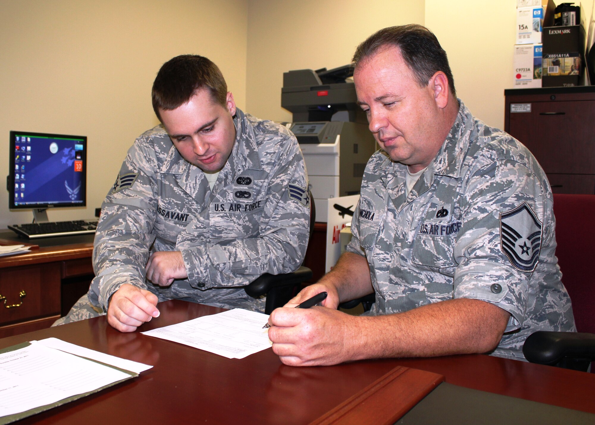 MSgt. Adrian Canchola, right, a member of the 127th Maintenance Squadron, looks over the worksheet used to prepare a will, Sept. 10, 2011, at Selfridge Air National Guard Base, Mich. Assisting Canchola is Senior Airman Benjamin Passavant, a legal specialist in the 127th Wing Judge Advocate General’s office. The JAG office routinely assists Airmen in preparing wills and related documents to help them keep their affairs in order should they need to deploy. (USAF photo by TSgt. Dan Heaton)