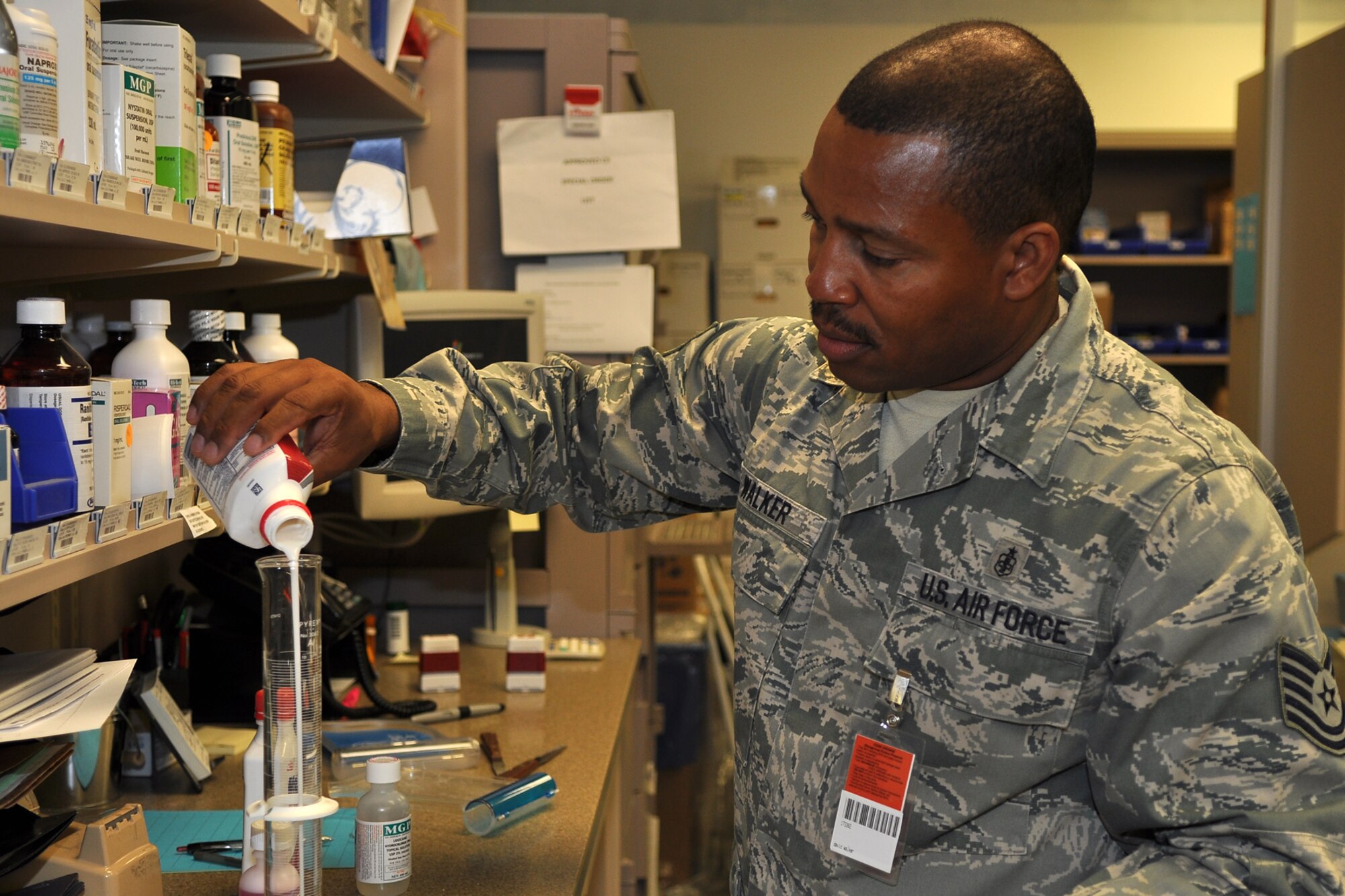 Technical Sgt. David Walker, a pharmacy technician assigned to the 307th Medical Squadron from Barksdale Air Force Base, La., mixes a three-part compound, while working at the 10th Medical Group pharmacy at the U.S. Air Force Academy in Colorado Springs, Colo., Aug. 22, 2011. He was part of a group of 307th Bomb Wing Airmen who were at the Academy as part of their annual tour training, Aug. 13-26, 2011. (U.S. Air Force photo by Betty Stephens/Released)