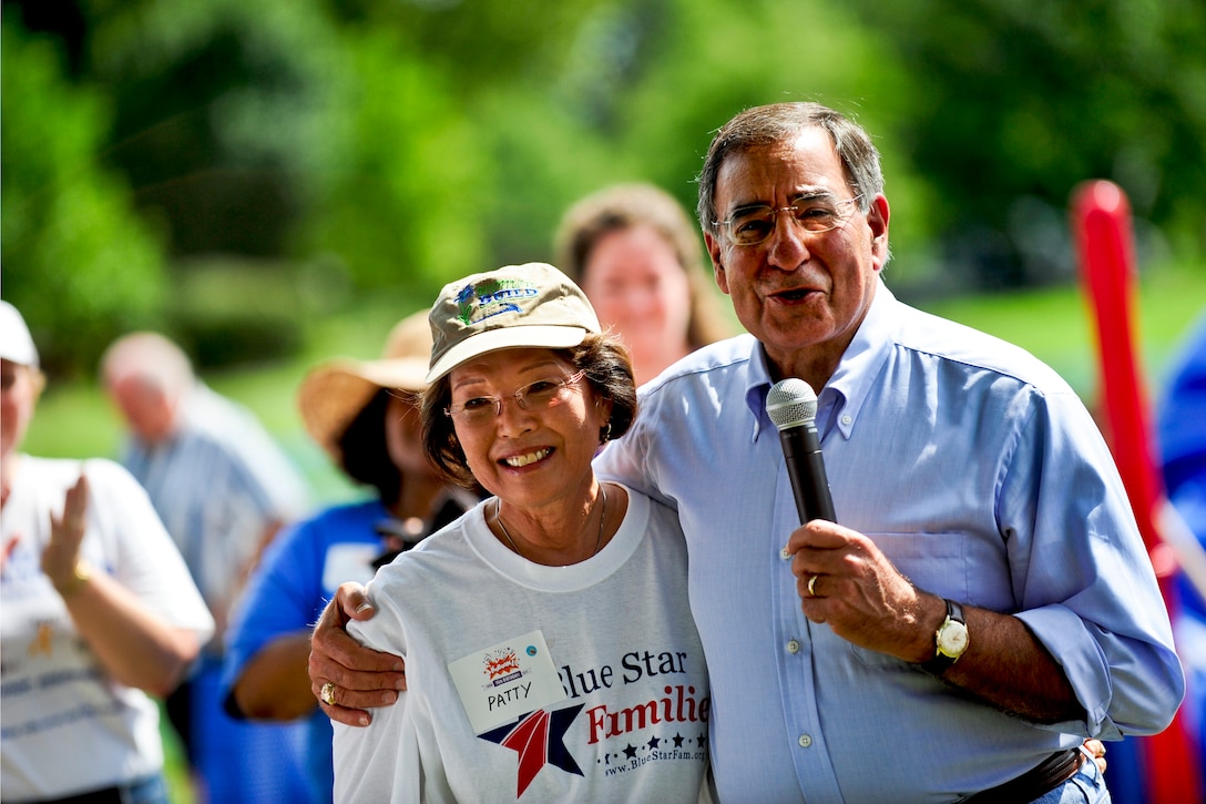 Defense Secretary Leon E. Panetta and Patty Shinseki, wife of retired Army Gen. Eric Shinseki, Veterans Affairs Secretary, thank volunteers who helped build a playground during the 9/11 National Day of Service and Remembrance on Fort George G. Meade, Md., Sept. 10, 2011.