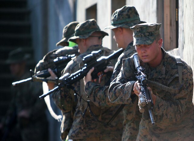 Marines with Bravo Company, 1st Battalion, 2nd Marine Regiment, conduct military operations in urban terrain training at the urban assault course on Fort Pickett, Va., Sept. 10, 2011. More than 900 Marines and sailors will take part in the deployment for training exercise at Fort Pickett, Sept. 6-23. The battalion is scheduled to attach to the 24th Marine Expeditionary Unit a few days after the training.