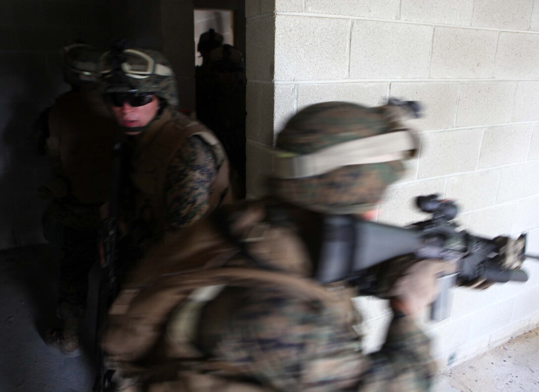 Marines with Bravo Company, 1st Battalion, 2nd Marine Regiment, conduct military operations in urban terrain training at the urban assault course on Fort Pickett, Va., Sept. 10, 2011. More than 900 Marines and sailors will take part in the deployment for training exercise at Fort Pickett, Sept. 6-23. The battalion is scheduled to attach to the 24th Marine Expeditionary Unit a few days after the training.