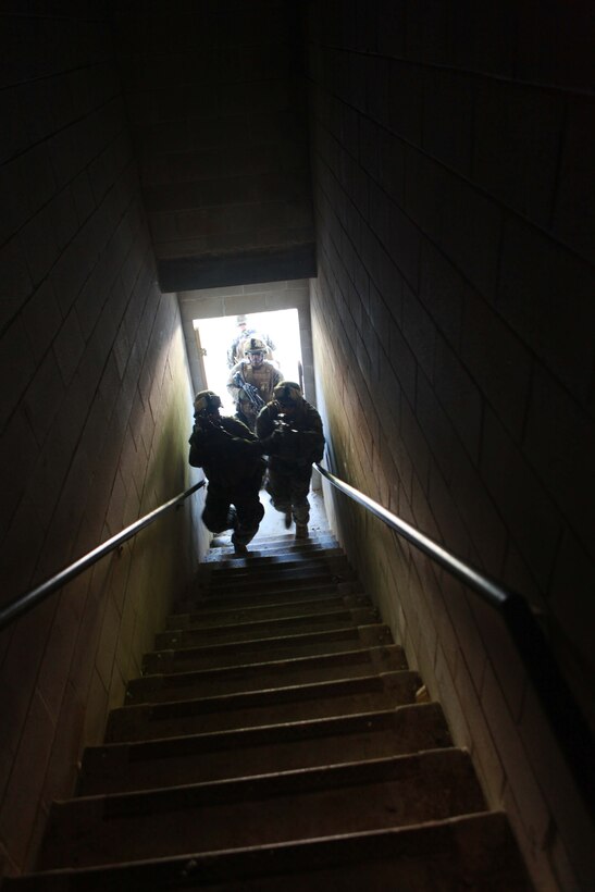 Marines with Bravo Company, 1st Battalion, 2nd Marine Regiment, enter a building during Military Operations in Urban Terrain training on the Urban Assault Course on Fort Pickett, Va., Sep. 10, 2011. More than 900 Marines and Sailors are taking part in the Deployment for Training exercise at Fort Pickett, scheduled to run Sept. 6-23. The battalion is scheduled to attach to the 24th Marine Expeditionary Unit as its Battalion Landing Team a few days after the training.