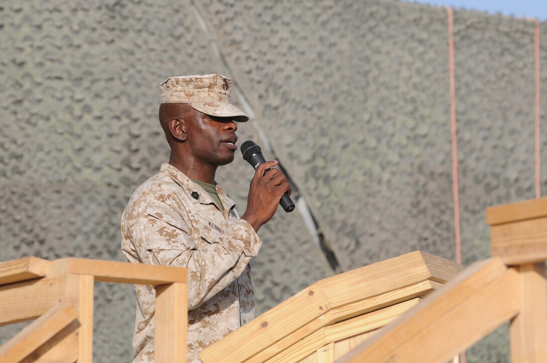 Master Sgt. Mark Kennedy, an administration chief with 2nd Marine Logistics Group (Forward), sings the national anthem during a 9/11 memorial ceremony aboard Camp Leatherneck, Afghanistan.  Kennedy comes from a long line of musicians in Jamaica and has been singing since he was a young boy.