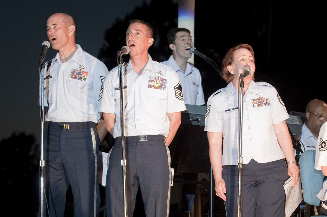 SrA Rich Smith, seen singing in the back while playing piano, scored an original concert band composition entitled "For You We Sing, America". Vocal accompany by TSgt Daniel Plaster, MSgt Gerald Lockwood, and TSgt Erin McPherson.

Photo by TSgt Chuck Hatton 
