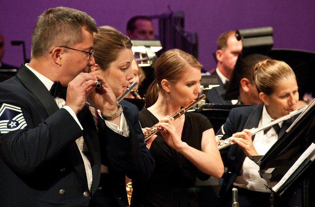 SMSgt Jurgen Schwarze and MSgt Susan Kanim fo the 562nd Air Force Band perform next to new recruit Karmen Suter. A few weeks after the recording session and concert she left for Boot Camp and is currently serving as one of our newest members.