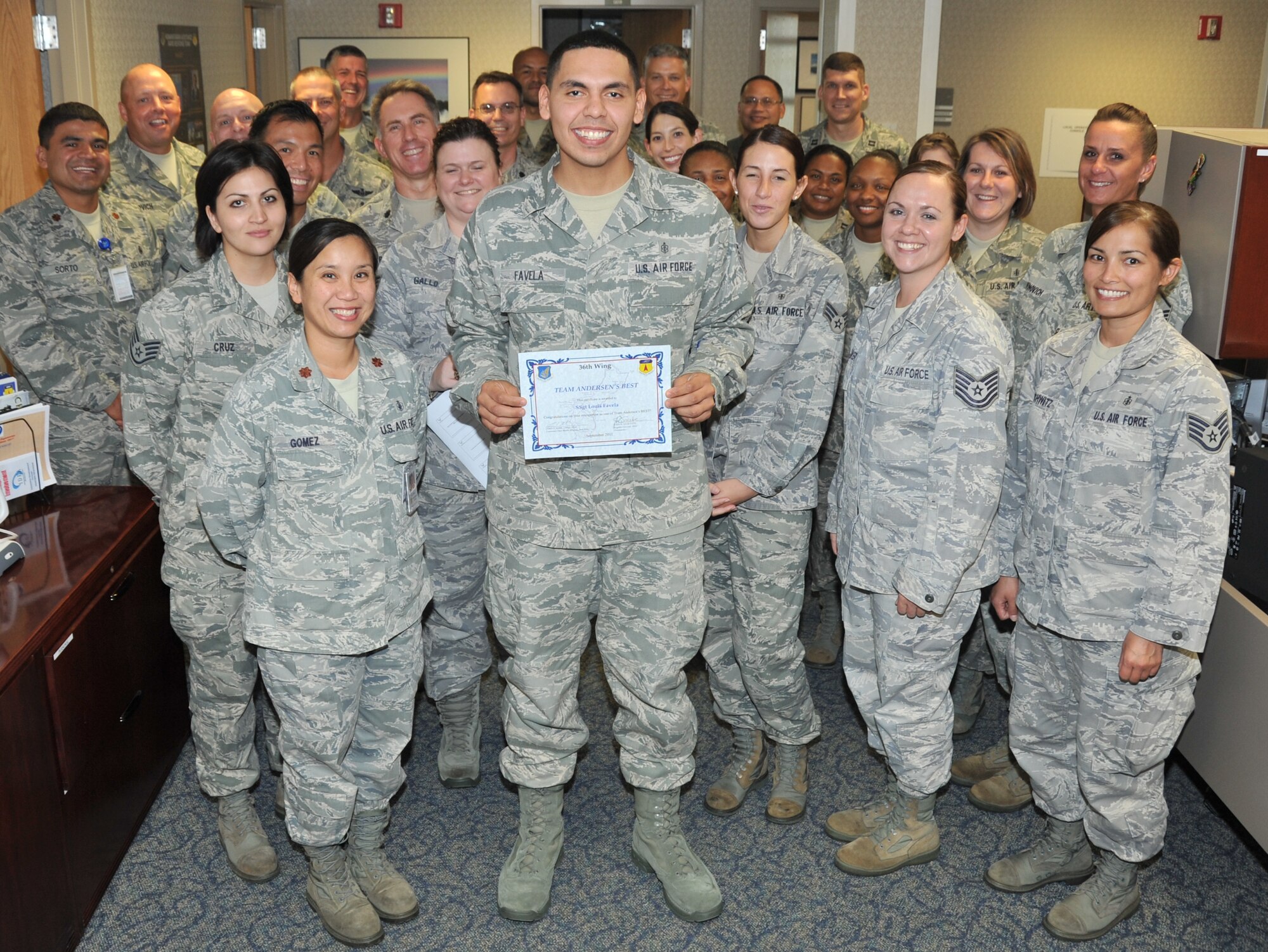 Staff Sgt. Louis Favela, 36th Medical Group noncommissioned officer in charge of education and training, was awarded Team Andersen's Best here, Sept. 8. Andersen's Best is a recognition program which highlights a top performer from the 36th Wing. Each week, supervisors nominate a member of their team for outstanding performance and the wing commander presents the selected Airman/civilian with an award. (U.S. Air Force photo by Staff Sgt. Alexandre Montes)
