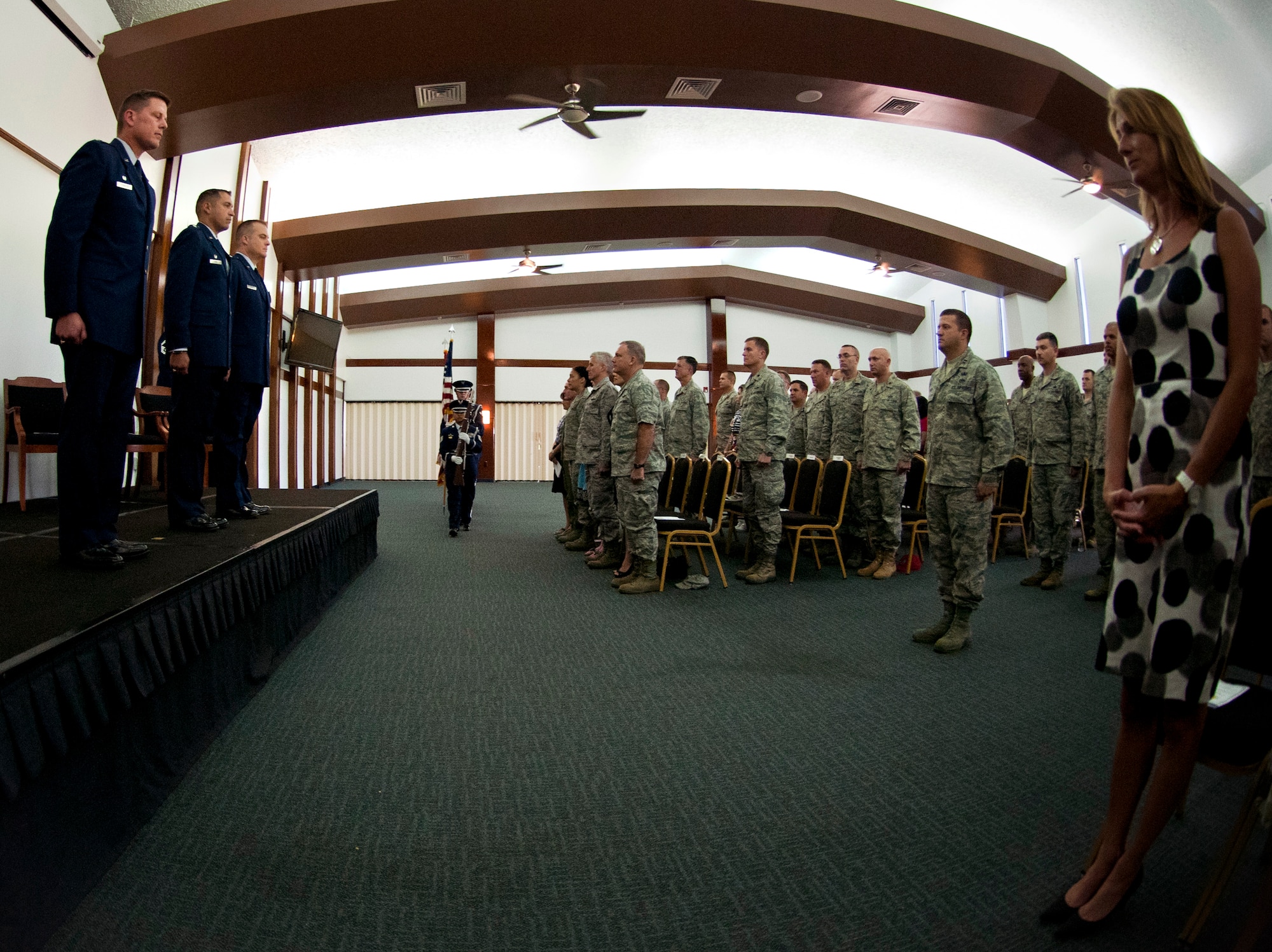 ANDERSEN AIR FORCE BASE, Guam— The Andersen Air Force Base Honor Guard presents the colors as personnel from around the base stand during the 36th Mobility Response Squadron change of command held at the Sunrise Conference Center here Sep. 7. Lt. Col.  Michael Black will be assuming command of the 36th MRS. (U.S. Air Force photo by Senior Airman Benjamin Wiseman/Released)