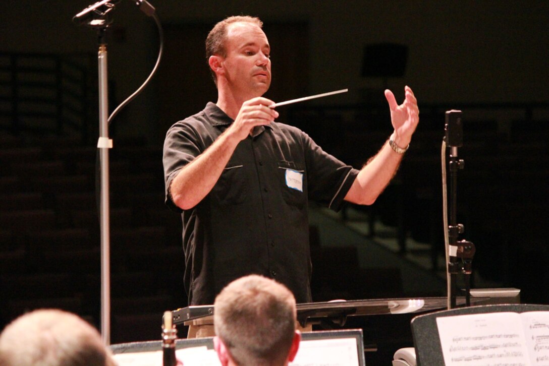 Major Eric Patterson of the 562nd Air Force Band conducts during the recording session for "Flag of Stars" in July 2010.

Photo by SrA Rich Smith