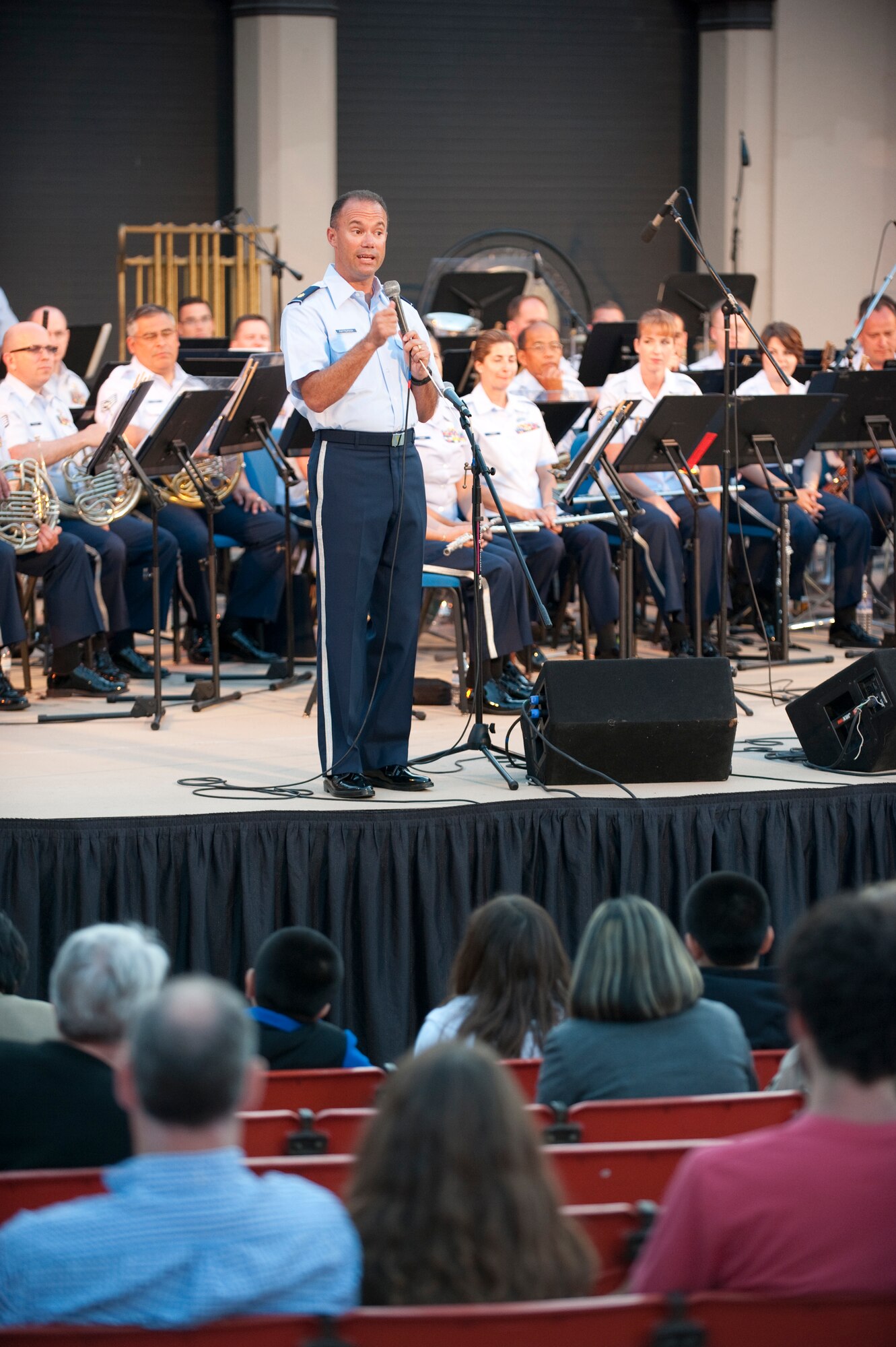 Major Eric Patterson, Commander of the Air National Guard Band of the Southwest, speaks to the audience in Anaheim, Ca July 15, 2001. Having just returned from the Middle East the day prior, Major Patterson shares a brief thank you for their support and then conducts one of the band's favorite marches -  "Americans We"

Photo by TSgt Chuck Hatton