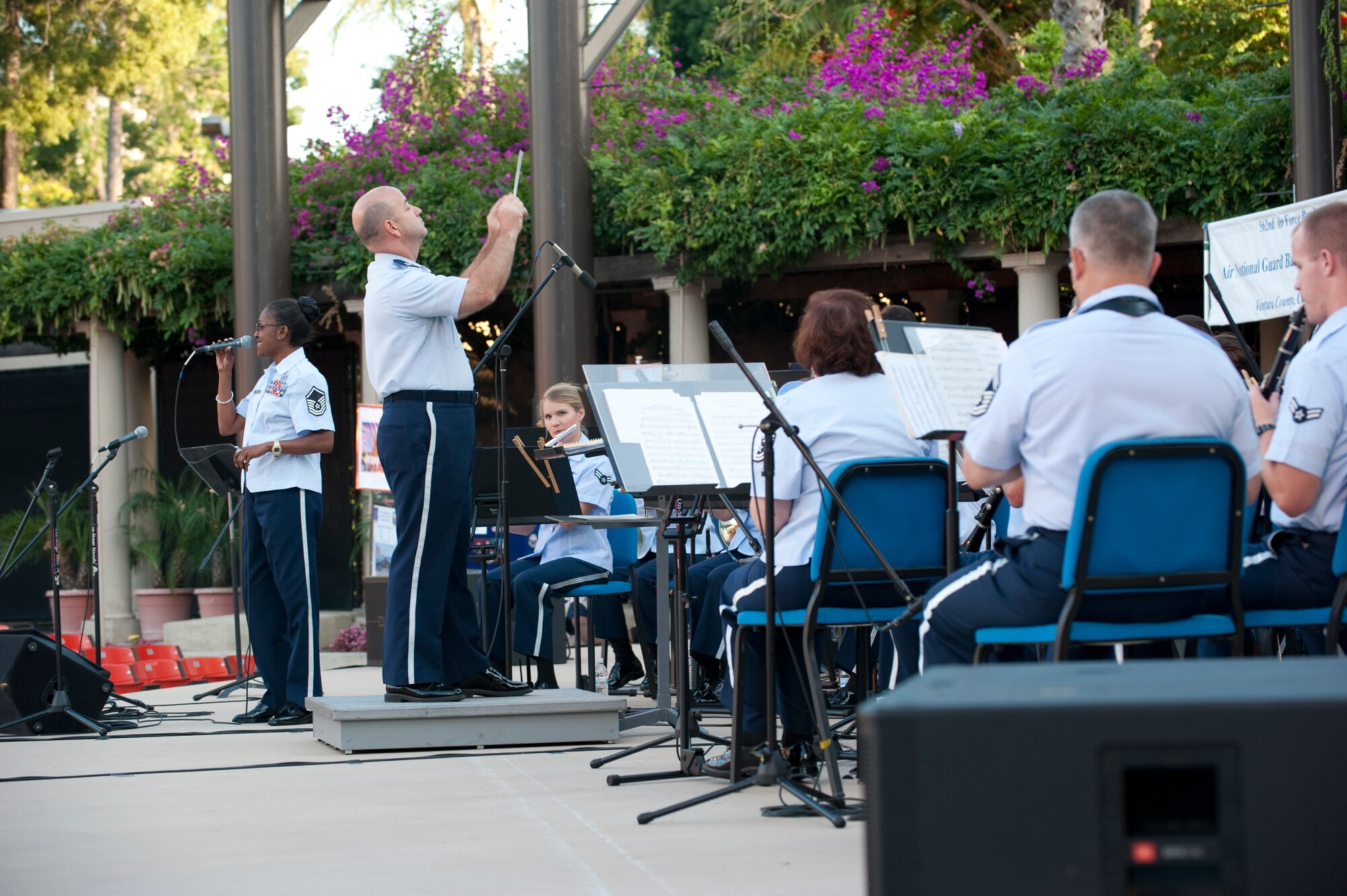 Major Mathews, Commander of the Air National Guard Band of the Gulf Coast, conducts the 562nd and 531st Air Force Bands in Aneheim, CA July 15 2011 during their tour of Southern California.

Photo by TSgt Chuck Hatton