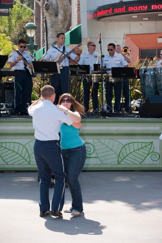 The Latin group "Fuego Azul" performs at Downtown Disney on July 11, 2011. The newest preformance group of the Air National Guard Band of the Southwest. They always get the folks on their feet dancing.

Photo by TSgt Chuck Hatton