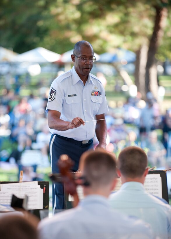 MSgt Greg Robinson, Associate Conductor for the 562nd Air Force Band conducts the combined Air National Guard Band in Westminster CA 10 July 2011.

Photo by TSgt Chuck Hatton