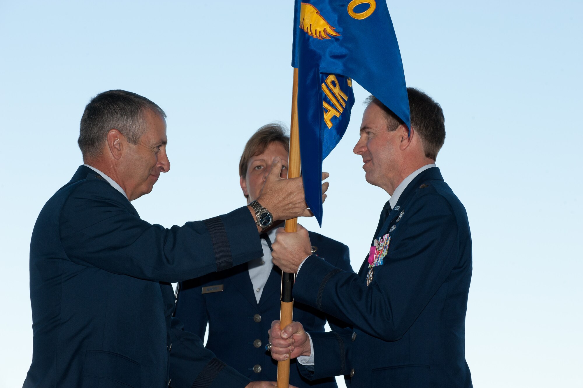 The Adjutant General of Colorado Maj. Gen. H. Michael Edwards passes the Joint Force Headquarters Flag to Brig. Gen. Richard L. Martin in a Change of Command ceremony at Buckley Air Force Base, Colo., Sept. 10, 2011. Martin is assuming command of the Colorado Air National Guard and the position of Assistant Adjutant General - Air. He previously held the position of Director of Operations for the Colorado Air National Guard. (U.S. Air Force photo/Master Sgt. John Nimmo, Sr.) (RELEASED)