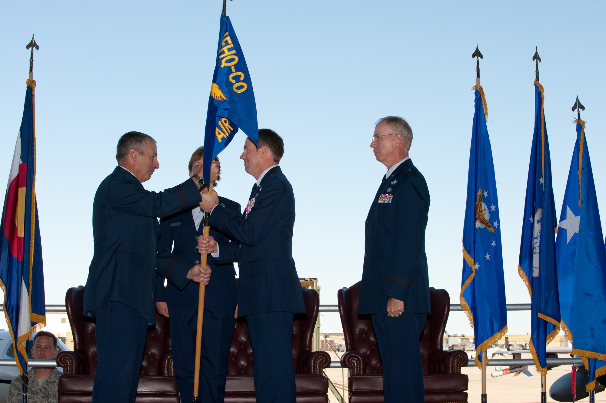 The Adjutant General of Colorado Maj. Gen. H. Michael Edwards passes the Joint Force Headquarters Flag to Brig. Gen. Richard L. Martin in a Change of Command ceremony at Buckley Air Force Base, Colo., Sept. 10, 2011. Martin is assuming command of the Colorado Air National Guard and the position of Assistant Adjutant General - Air. He previously held the position of Director of Operations for the Colorado Air National Guard. (U.S. Air Force photo/Master Sgt. John Nimmo, Sr.) (RELEASED)