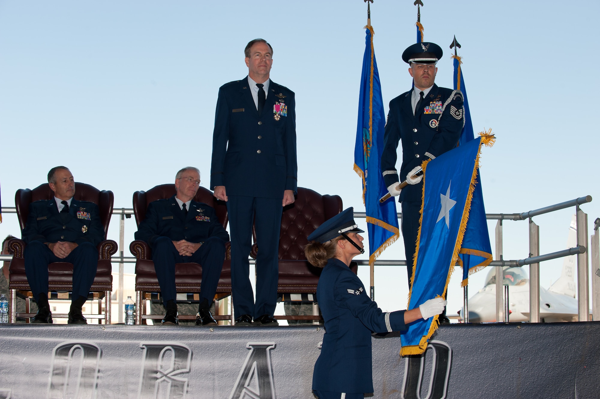 Brig. Gen. Richard L. Martin stands at attention as the 140th Wing Color Guard unfurls his one-star flag during Martin's promotion ceremony at Buckley Air Force Base, Colo., Sept. 10. Martin is assuming command of the Colorado Air National Guard and the position of Assistant Adjutant General - Air. (U.S. Air Force photo/Master Sgt. John Nimmo, Sr.) (RELEASED)