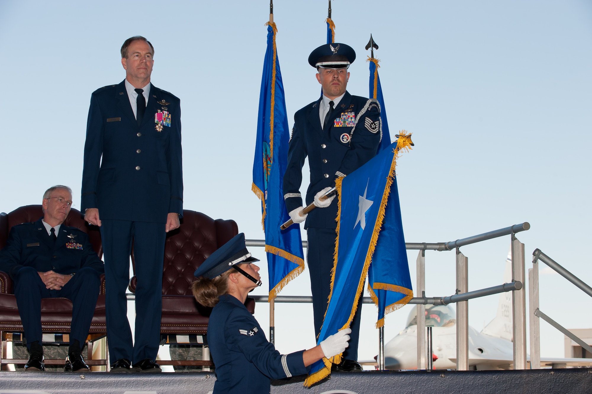 Brig. Gen. Richard L. Martin stands at attention as the 140th Wing Color Guard unfurls his one-star flag during Martin's promotion ceremony at Buckley Air Force Base, Colo., Sept. 10. Martin is assuming command of the Colorado Air National Guard and the position of Assistant Adjutant General - Air. (U.S. Air Force photo/Master Sgt. John Nimmo, Sr.) (RELEASED)
