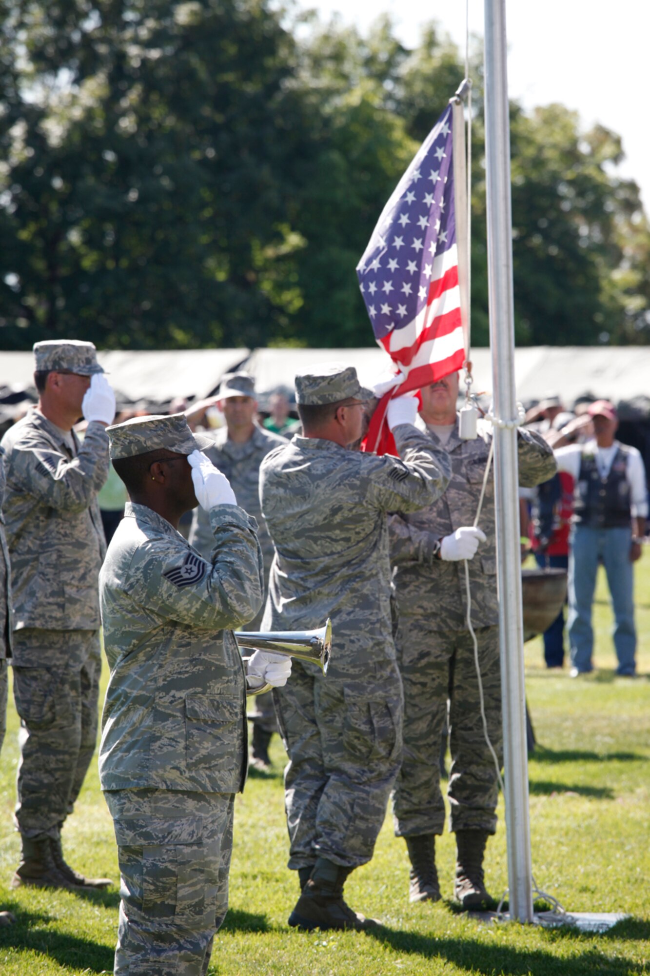 The wing’s honor guard raises a flag to half-staff during a tribute to the tenth anniversary of 9/11. (U.S. Air Force photo/Senior Airman Christopher Clark) 
