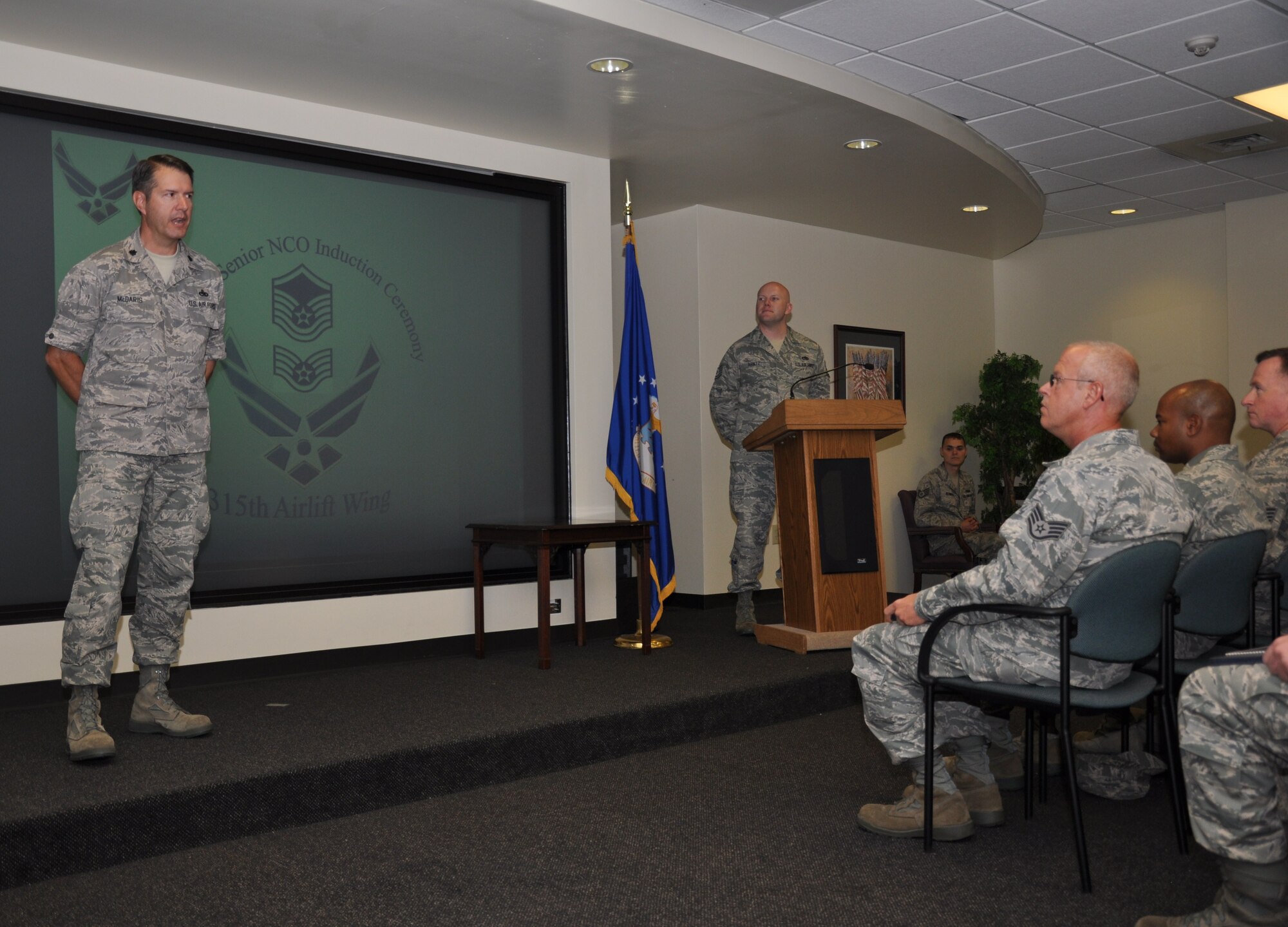 Lt. Col. Robert W. McDaris Jr., speaks to members of the 315th Airlift Wing at Joint Base Charleston, S.C. Sept. 10, 2011 during the noncommissioned officer corps and the senior noncommissioned officer corps inductions ceremony. Colonel McDaris is the assistant deputy commander for the 315 Airlift Wing Maintenance Group. (U.S. Air Force photo\Staff Sgt. Shane Ellis)