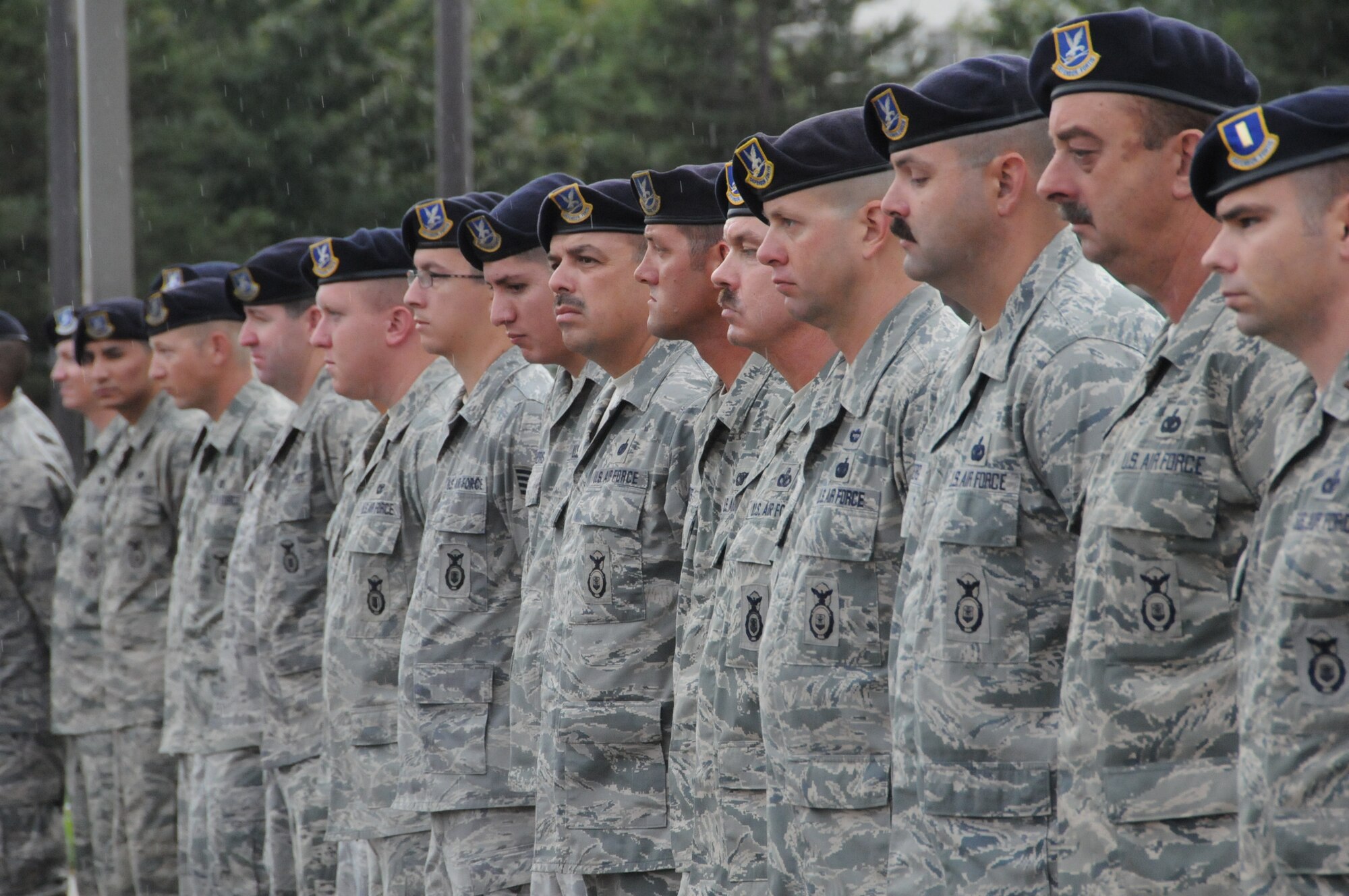 Members of the 144th Security Forces Squadron, 144 Fighter Wing, California Air National Guard, Fresno Calif., pause to honor those who served, perished and paid the ultimate sacrifice during a remembrance ceremony on Sept. 11, 2011. The ceremony included time to ponder our great losses, an invocation from the base chaplain, a 21 gun salute and a display of military and civilian emergency vehicles. (U.S. Air Force photo by MSgt David Loeffler)