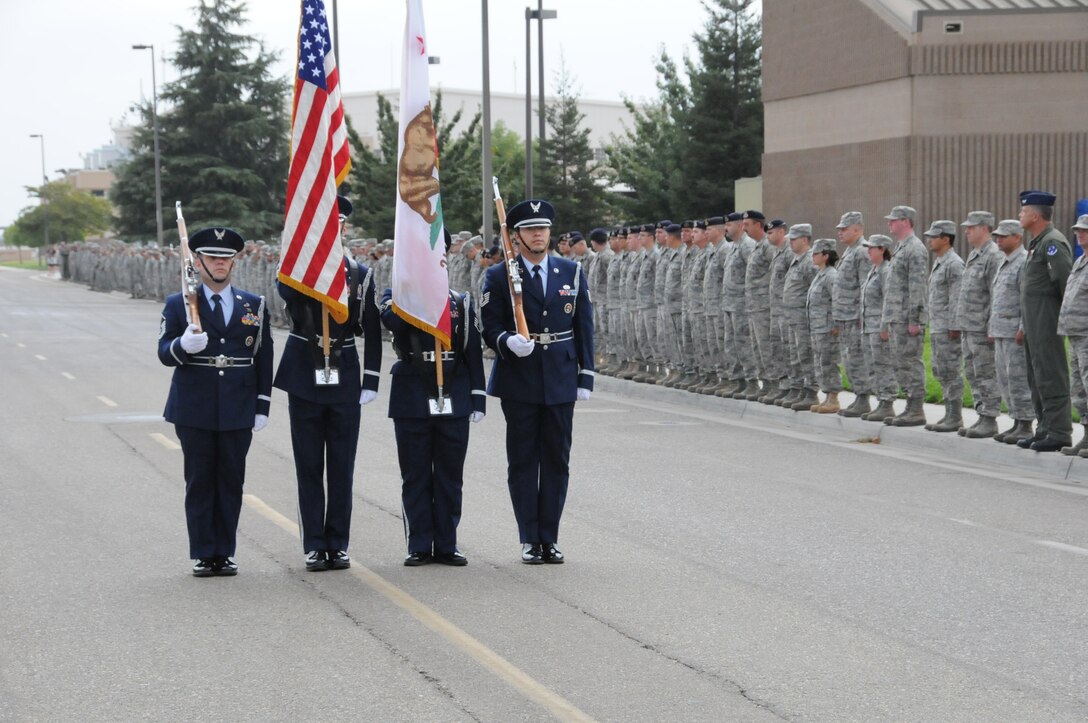 Members of the 144 Fighter Wing, California Air National Guard, Fresno Calif., pause to honor those who served, perished and paid the ultimate sacrifice during a remembrance ceremony on Sept. 11, 2011. The ceremony included time to ponder our great losses, an invocation from the base chaplain, a 21 gun salute and a display of military and civilian emergency vehicles. (U.S. Air Force photo by MSgt David Loeffler)