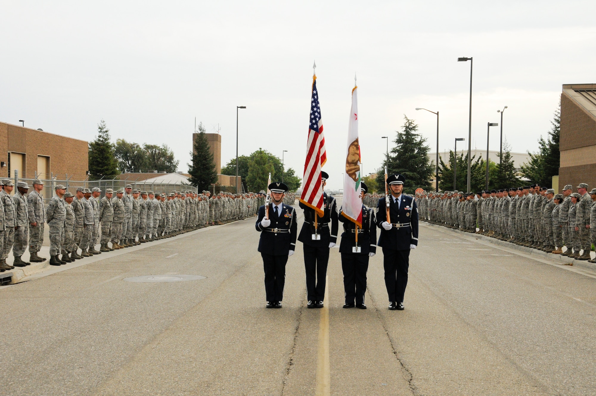 On Sept. 11, 2011, members of the 144th Security Forces Squadron, 144 Fighter Wing, California Air National Guard, Fresno Calif., stand by for a 21 gun salute to honor those who served, perished and paid the ultimate sacrifice. The ceremony included time to ponder our great losses, an invocation from the base chaplain, a 21 gun salute and a display of military and civilian emergency vehicles. (U.S. Air Force photo by Tech. Sgt Robin D. Meredith)