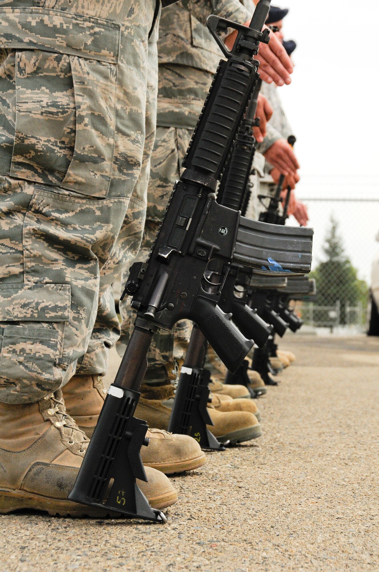 On Sept. 11, 2011, members of the 144th Security Forces Squadron, 144 Fighter Wing, California Air National Guard, Fresno Calif., stand by for a 21 gun salute to honor those who served, perished and paid the ultimate sacrifice. The ceremony included time to ponder our great losses, an invocation from the base chaplain, a 21 gun salute and a display of military and civilian emergency vehicles. (U.S. Air Force photo by Tech. Sgt Robin D. Meredith)