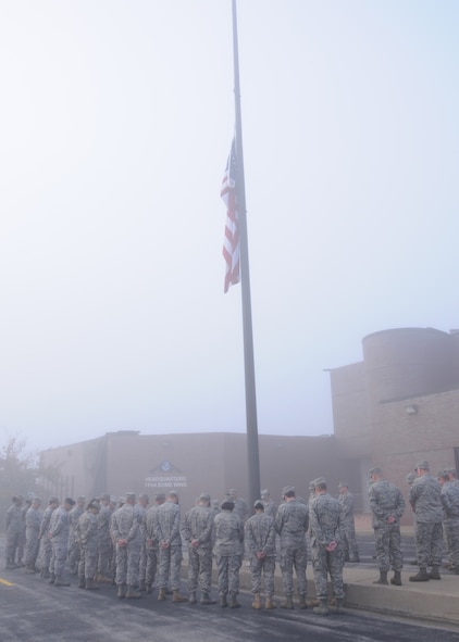 Members of the 131st Bomb Wing, Missouri Air National Guard, at Lambert Saint-Louis ANGB, attend an early morning 9-11 rememberance ceremony led by Chaplain 1Lt. Lance Qualmann.  A moment of silence was held at 7:46am central time to coincide with when the first World Trade Center Tower was hit by terrorists in a hijacked aircraft 10 years ago. (Photo by Master Sgt. Mary-Dale Amison)