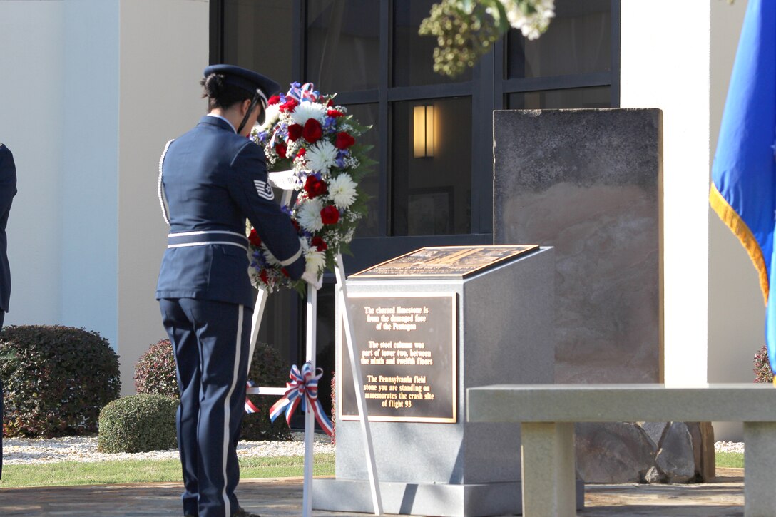 Tech. Sgt. Martha Dunning, a member of the 601st Air and Space Operations Center Honor Guard, lays a wreath at the 9/11 Memorial at the 601st AOC Sept. 11, 2011, at Tyndall Air Force Base, Fla. The Continental U.S. North American Aerospace Defense Command Region-1st Air Force (Air Forces Northern) held a ceremony to honor the memory of those who died during the worst terrorist attack on American soil. (U.S. Air Force photo by Angela Pope)