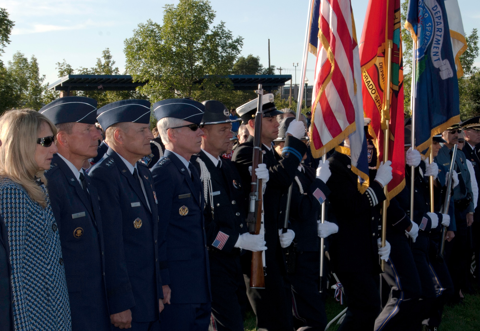 The El Paso County Sheriff and Colorado Springs Police Department Combined Color Guard posts the colors at a ceremony in America the Beautiful Park Sept. 11, 2011, to commemorate those who lost their lives in the terrorist attacks 10 years earlier. Also pictured, left, are Paula Gould and her husband, Air Force Academy Superintendent Lt. Gen. Mike Gould, Air Force Space Command Vice Commander Lt. Gen. Michael Basla and AFSPC Commander Gen. William Shelton. (U.S. Air Force photo/Don Branum)