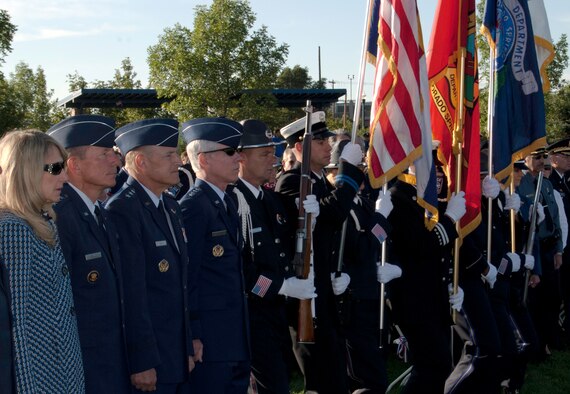 The El Paso County Sheriff and Colorado Springs Police Department Combined Color Guard posts the colors at a ceremony in America the Beautiful Park Sept. 11, 2011, to commemorate those who lost their lives in the terrorist attacks 10 years earlier. Also pictured, left, are Paula Gould and her husband, Air Force Academy Superintendent Lt. Gen. Mike Gould, Air Force Space Command Vice Commander Lt. Gen. Michael Basla and AFSPC Commander Gen. William Shelton. (U.S. Air Force photo/Don Branum)