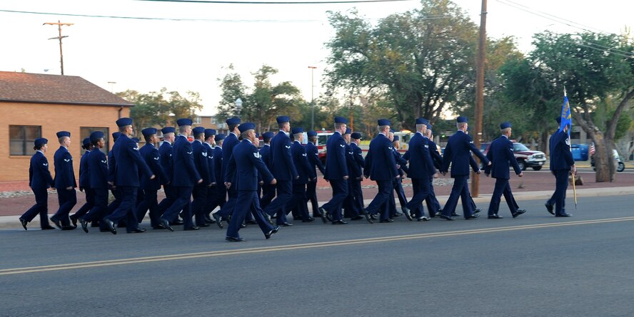 The September 11th memorial formation marches towards the fire station at Cannon Air Force Base, N.M., Sept. 11, 2011. The memorial walk was held to honor the almost 3000 people that died on September 11, 2001, over 200 people participated in this event.  (U.S. Air Force photo by Airman 1st Class Xavier Lockley)