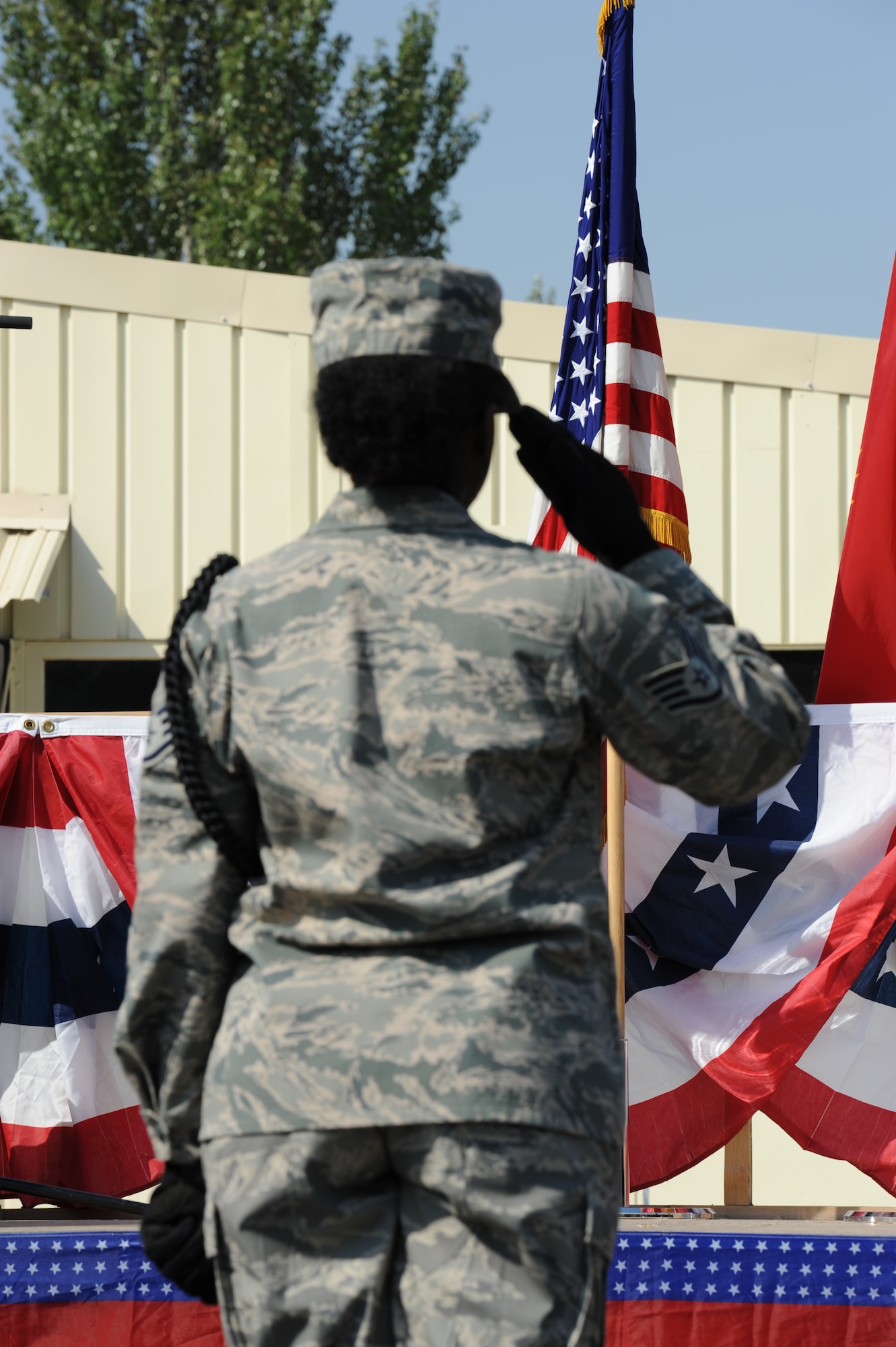 A member of the376th Air Expeditionary Wing Honor Huard salutes during “Taps” at the 9/11 Remembrance Ceremony at the Transit Center at Manas, Kyrgyzstan, Sept. 11. Distinguished visitors from 16 different countries attended the ceremony, including Kyrgyz Republic President Roza Otunbayeva. (U.S. Air Force photo/Tech. Sgt. Hank Hoegen)