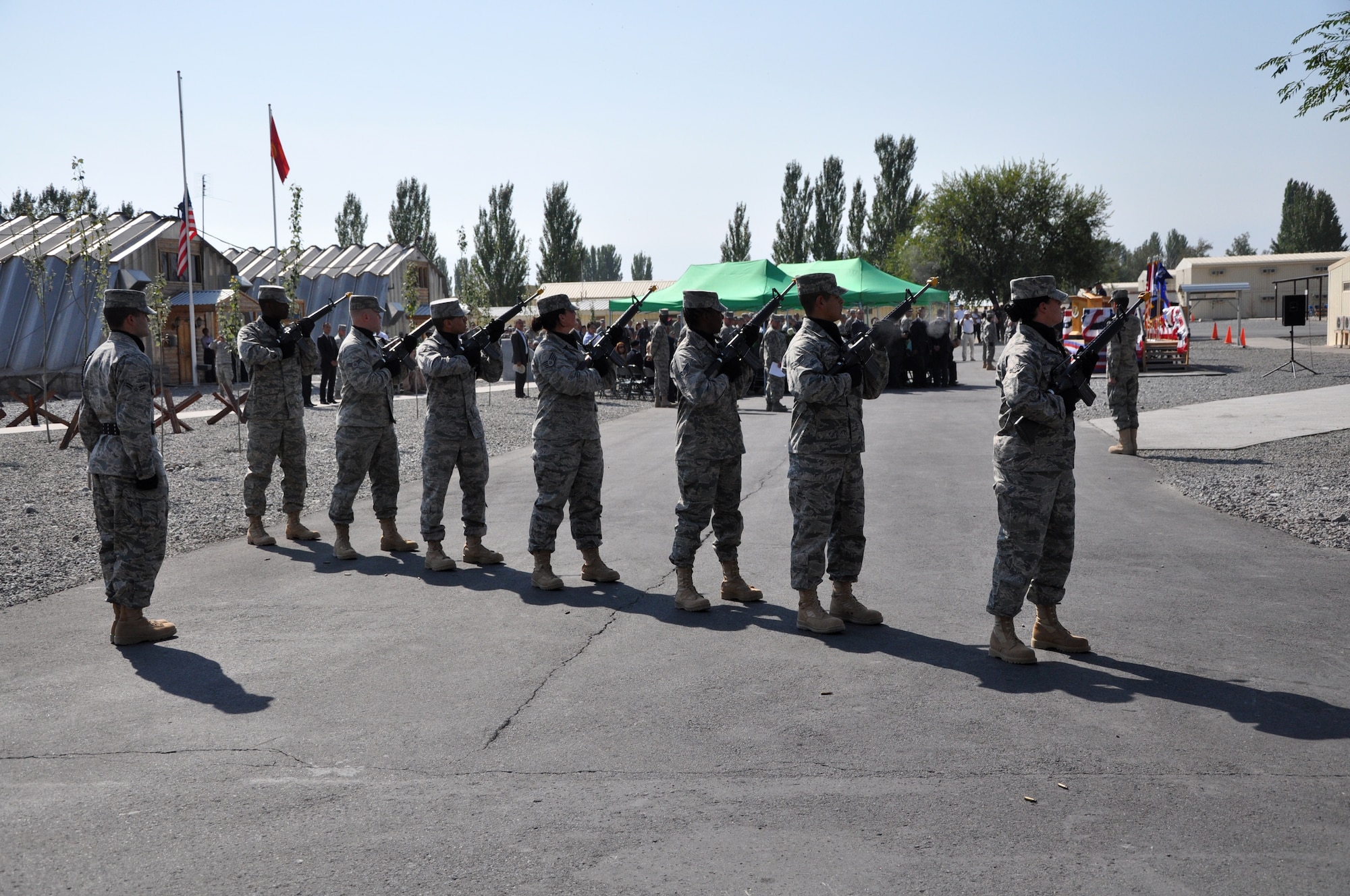 Members of the 376th Security Forces Squadron perform a 21-gun salute during the 9/11 Remembrance Ceremony at the Transit Center at Manas, Kyrgyzstan. The ceremony included speeches from Kyrgyz Republic President Roza Otunbayeva, U.S. Embassy Charge d'Affaires Larry Memmott, and Transit Center Director Col. James Jacobson.