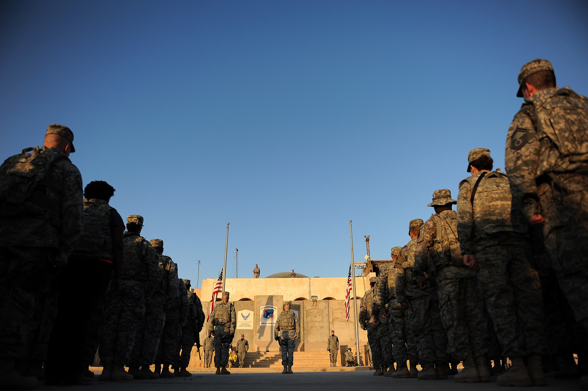 Brig. Gen. Anthony Rock, 321st Air Expeditionary Wing commander, leads a Sept. 11, 2011, remembrance ceremony at Sather Air Base, Iraq, in honor of the tenth anniversary of the 2001 attacks on the World Trade Center, the Pentagon and in Shanksville, Pa. More than 100 Soldiers, Sailors Airmen and civilians took part in a two-mile remembrance march in full battle rattle. (U.S. Air Force photo/Staff Sgt. Mike Meares)