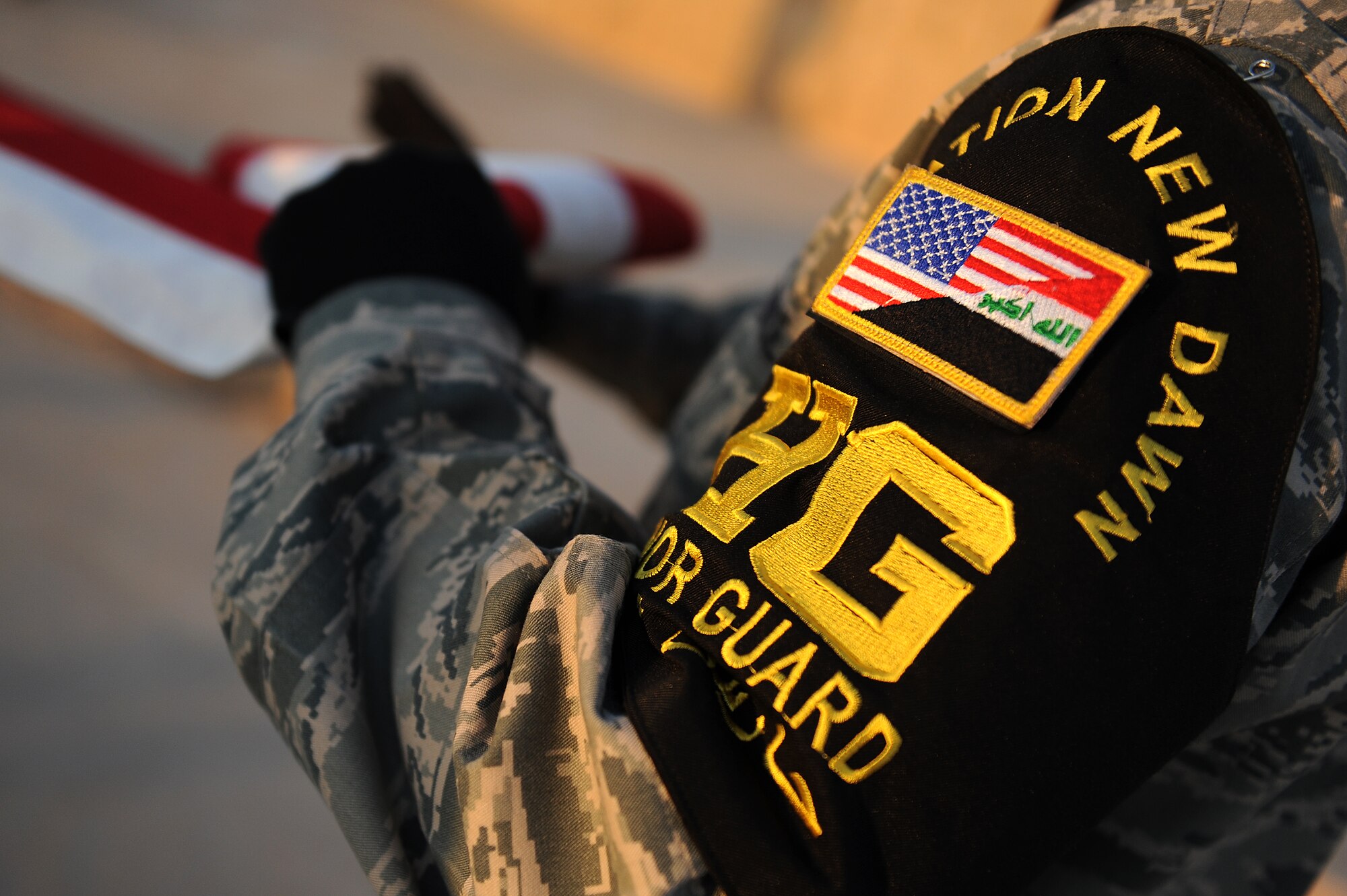 Staff Sgt. Anthony Inauen, 447th Expeditionary Communications Squadron, folds the U.S. flag to ceremonially retire the colors to Brig. Gen. Anthony Rock, 321st Air Expeditionary Wing commander, Sept. 11, 2011, in honor of the 10th anniversary of the attacks. More than 100 Soldiers, Sailors Airmen and civilians who took part in a remembrance march in full battle rattle. The two-mile march, split up into groups of 10, honored those who lost their lives during the attacks at the World Trade Center, the Pentagon and in Shanksville, Pa. (U.S. Air Force photo/Staff Sgt. Mike Meares)