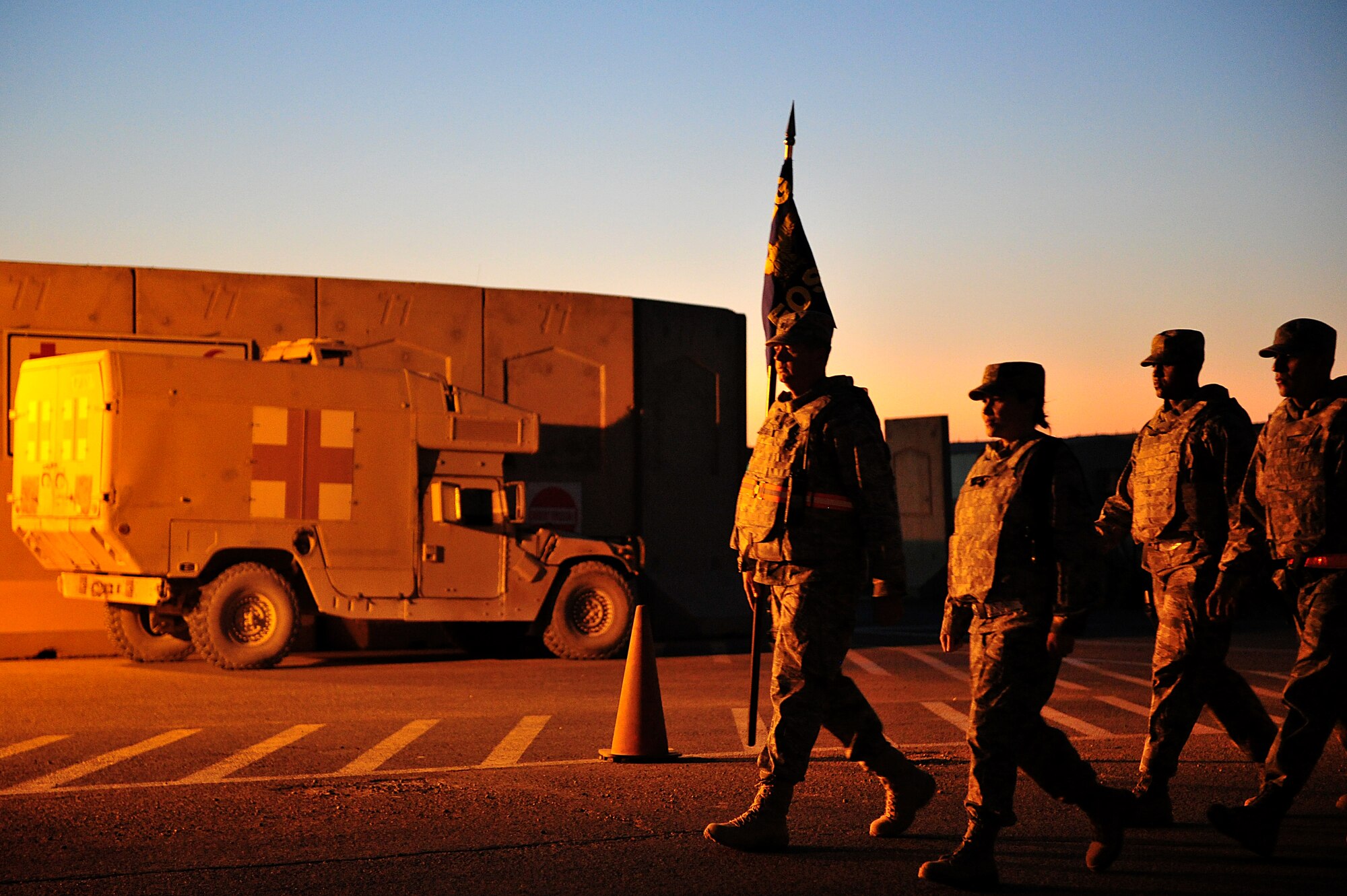 Participants of a two-mile road march honoring the tenth anniversary of the 9/11 attacks, press forward at Sather Air Base, Iraq, Sept. 11, 2011. More than 100 Soldiers, Sailors, Airmen and civilians donned their body armor and took part in the march as the sun rose. (U.S. Air Force photo/Tech. Sgt. Josef Cole)