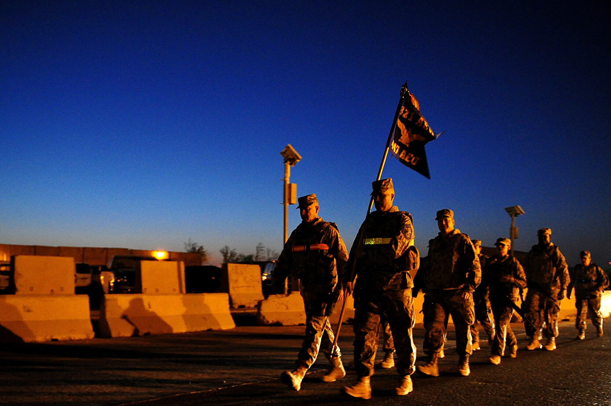 Participants of a two-mile road march honoring the tenth anniversary of the 9/11 attacks, press forward at Sather Air Base, Iraq, Sept. 11, 2011. More than 100 Soldiers, Sailors, Airmen and civilians donned their body armor and took part in the march as the sun rose. (U.S. Air Force photo/Tech. Sgt. Josef Cole)


