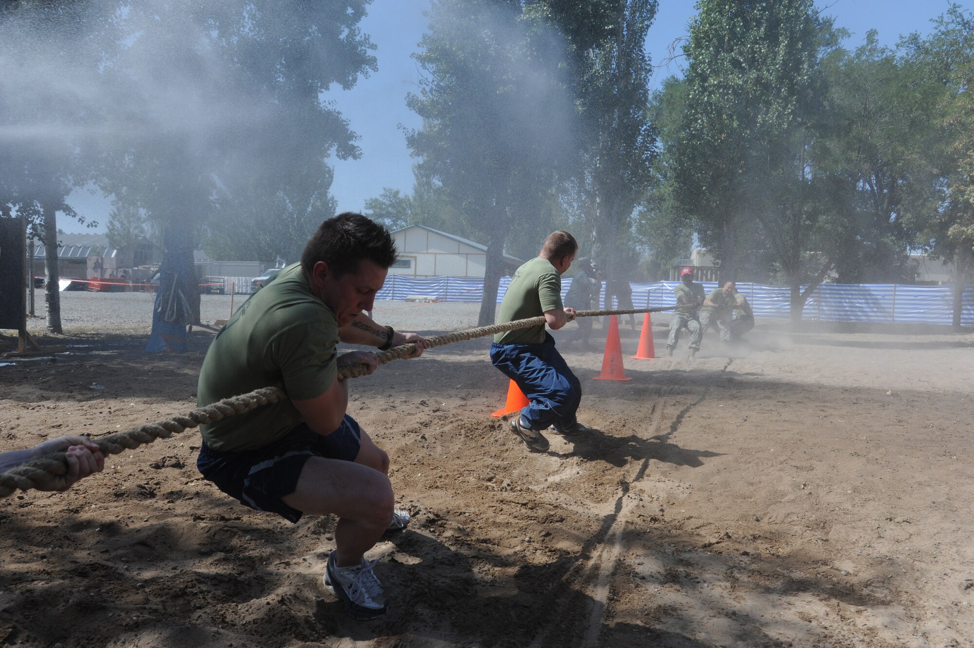 Staff Sgt. Brandon Knutson, left, and Airman 1st Class Sean Vojvodich, both 376th Expeditionary Maintenance Group structural repair specialists, give everything they’ve got during a tug of war event at the Transit Center at Manas, Kyrgyzstan, Sept. 10. The event was part of the Pete Ganci’s Inaugural First Responder’s Challenge, one of many 9/11 memorial events at the Transit Center. Knutson is deployed from the 141st Maintenance Squadron and Vojvodich is deployed from the 92nd Maintenance Group, both at Fairchild Air Force Base, Wash.  (U.S. Air Force photo/Tech. Sgt. Hank Hoegen)