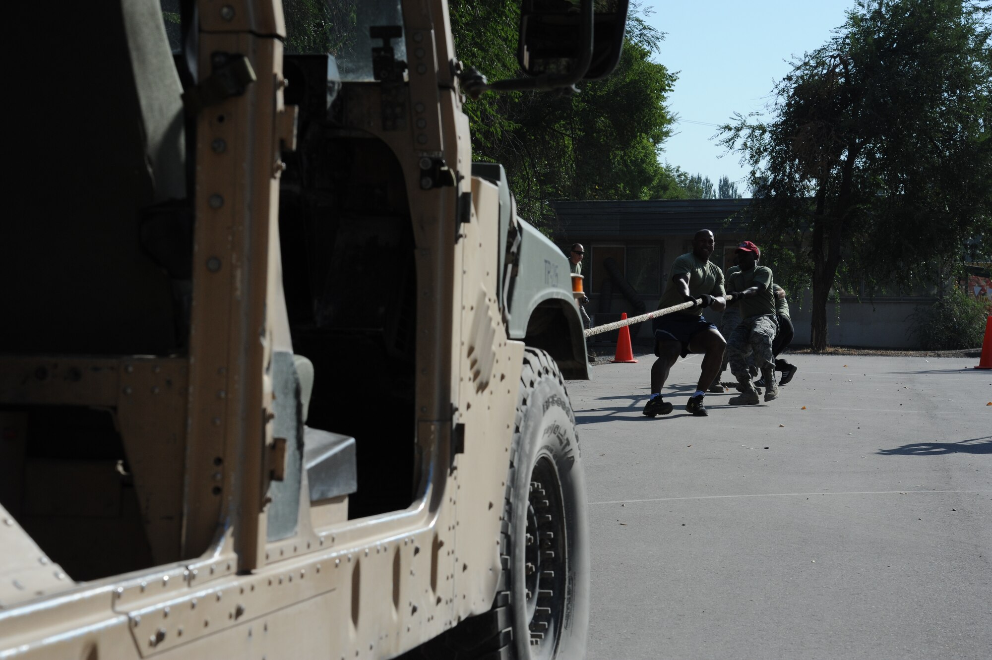 A group of Airmen pull a Humvee during the Pete Ganci’s Inaugural First Responder’s Challenge at the Transit Center at Manas, Kyrgyzstan, Sept. 10. Participants had to pull, then push, the Humvee approximately 80 feet each way. The challenge was one of many 9/11 memorial events here. Most of the events were named after service members who were killed in action Supporting Operations Iraqi and Enduring Freedom. (U.S. Air Force photo/Tech. Sgt. Hank Hoegen)