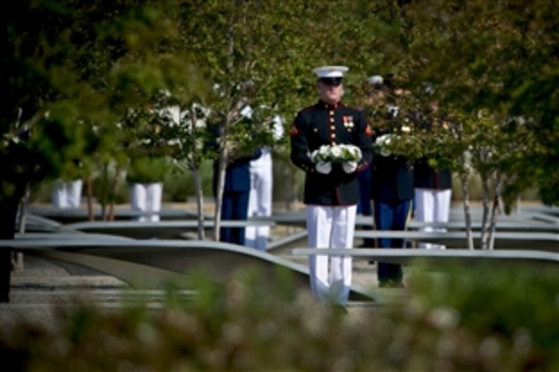A U.S. Marine lays a wreath at the Pentagon 9/11 observance ceremony, Sept. 11, 2011, honoring the 184 victims killed when American Airlines Flight 77 crashed into the Pentagon during a terrorist attack 10 years ago.