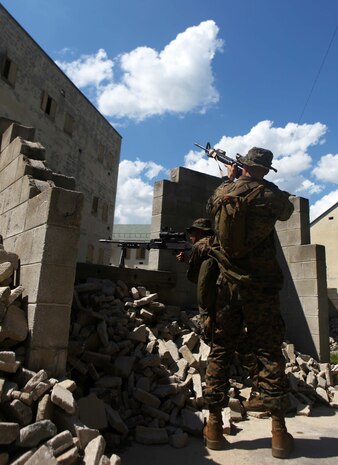 Marines and Sailors with Bravo Company, 1st Battalion, 2nd Marine Regiment, conduct Military Operations in Urban Terrain training at the Urban Assault Course on Fort Pickett, Va., Sept. 11, 2011. More than 900 Marines and sailors will take part in the Deployment for Training exercise at Fort Pickett, Sept. 6-23. The battalion is scheduled to attach to the 24th Marine Expeditionary Unit a few days after the training.