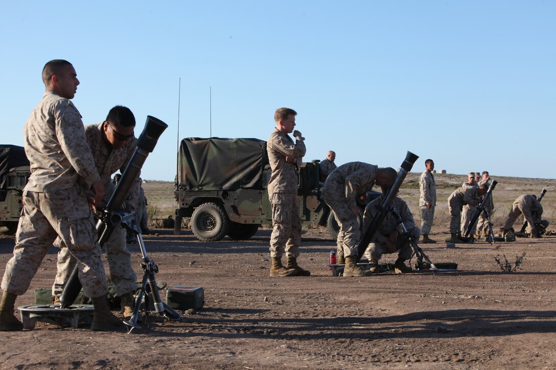 Marines with 81mm mortar platoon, Weapons Company, Battalion Landing Team 3/1, conduct gun drills here Sept. 11 to prepare for a live-fire exercise. The battalion is the ground combat element for the 11th Marine Expeditionary Unit, which is conducting its second sea-based exercise since becoming a complete Marine air-ground-task force in May.
