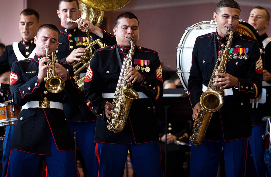 (Left to right) Cpl. Paul A. Tafoya, Sgt. Christopher L. Esquivel and Sgt. Lancelot Muschamp, members of the U.S. Marine Corps Forces, Pacific Party Band, step out to rock the crowd with the song “Sing, Sing, Sing” at the Stratford Memorial War Memorial Centre here Sept. 13. The concert was held for the Stratford community to celebrate the 70th anniversary of Marines landing in Wellington in 1942. (Official U.S. Marine Corps photo by Lance Cpl. Isis M. Ramirez)
