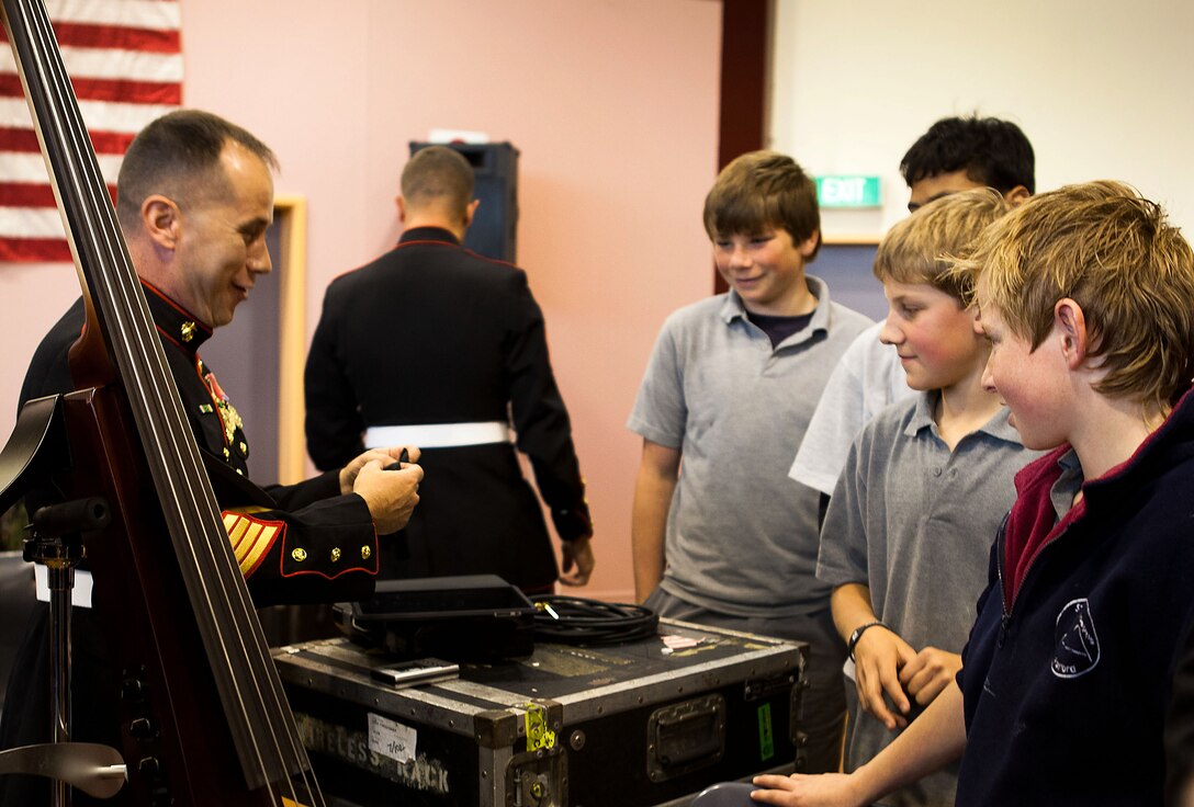 Staff Sgt. Charles Harbinson, a bass player for the U.S. Marine Corps Forces, Pacific band, talks to Stratford school children about his performance at the Stratford War Memorial Centre Sept 13. The MARFORPAC band held a concert as a community outreach event to celebrate the 70th anniversary of the Marines landing in Wellington in 1942.
