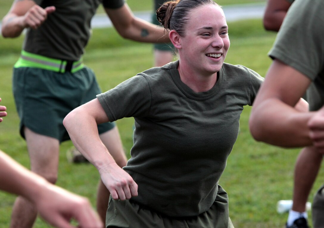 Cpl. Katie Brawner, engineer, Engineer platoon,  Headquarters Battery, 10th Marines, 2nd Marine Division, takes part in a high intensity work-out during the 9/11 Memorial Physical Training session conducted aboard the Marine Corps Base Camp Lejeune N.C., Sept. 12. Following the Memorial PT session the Marines were gathered together and asked to share their personal testimonials of the 9/11 attacks.