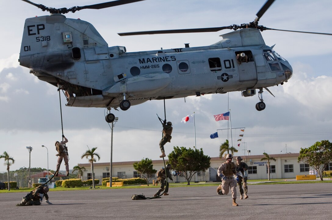 Marines with Company E, Battalion Landing Team 2nd Battalion,7th Marines, 31st Marine Expeditionary Unit, fast rope out of a CH-46E Sea Knight helicopter during a MEU pre-deployment training exercise Sept. 12. The training exercise is in preperation for the MEU's upcoming deployment. The 31st MEU is the only continuously forward-deployed MEU and remains the nation's force in readiness in the Asia-Pacific region.